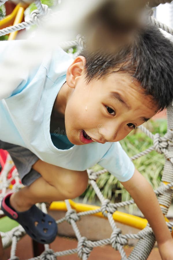 A child climbing a jungle gym