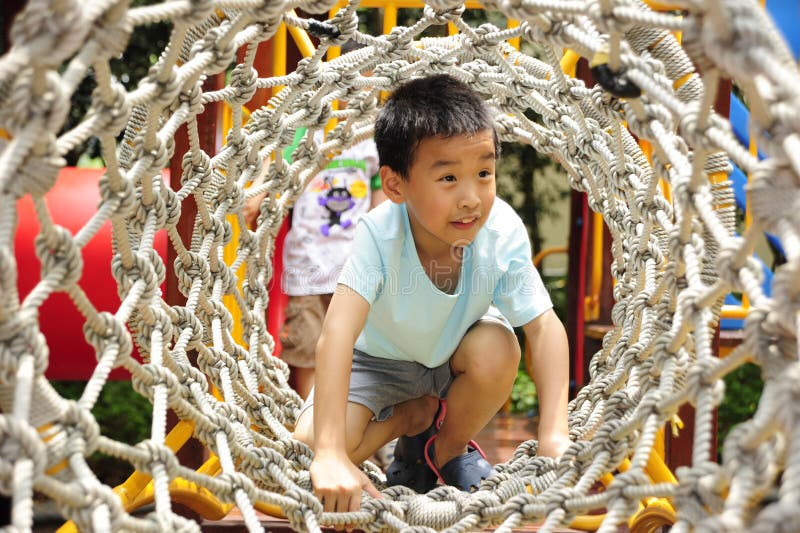 A child climbing a jungle gym.