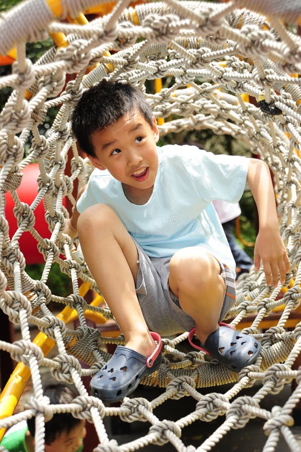 A child climbing a jungle gym.