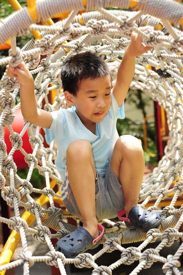 A child climbing a jungle gym.