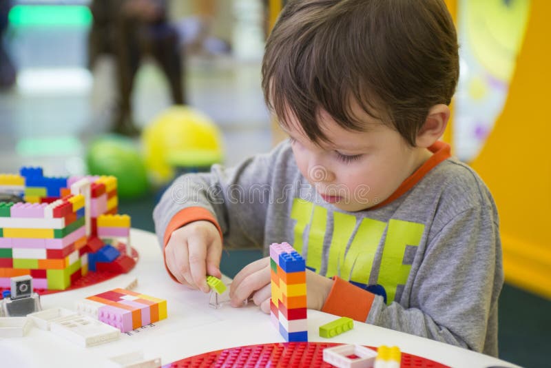 The Child Collects in a Can and Eat, Raspberries Stock Photo Image of