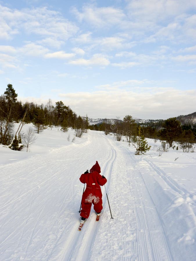 Little child long distance cross country skiing alone in a winter landscape. Boring kid white stock images, royalty-free photos and pictures