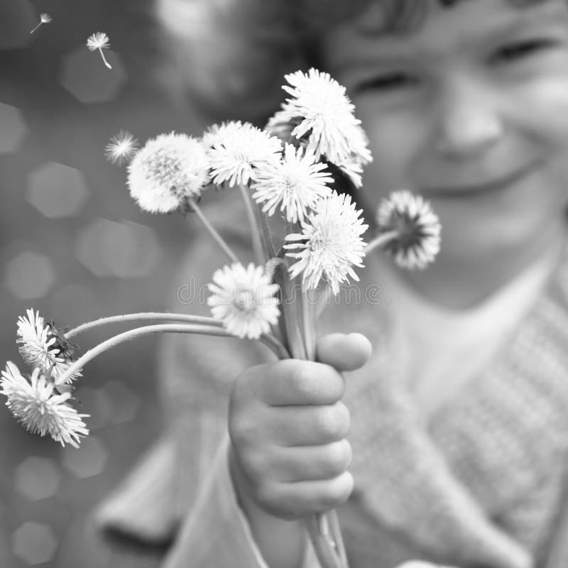 Child with dandelion