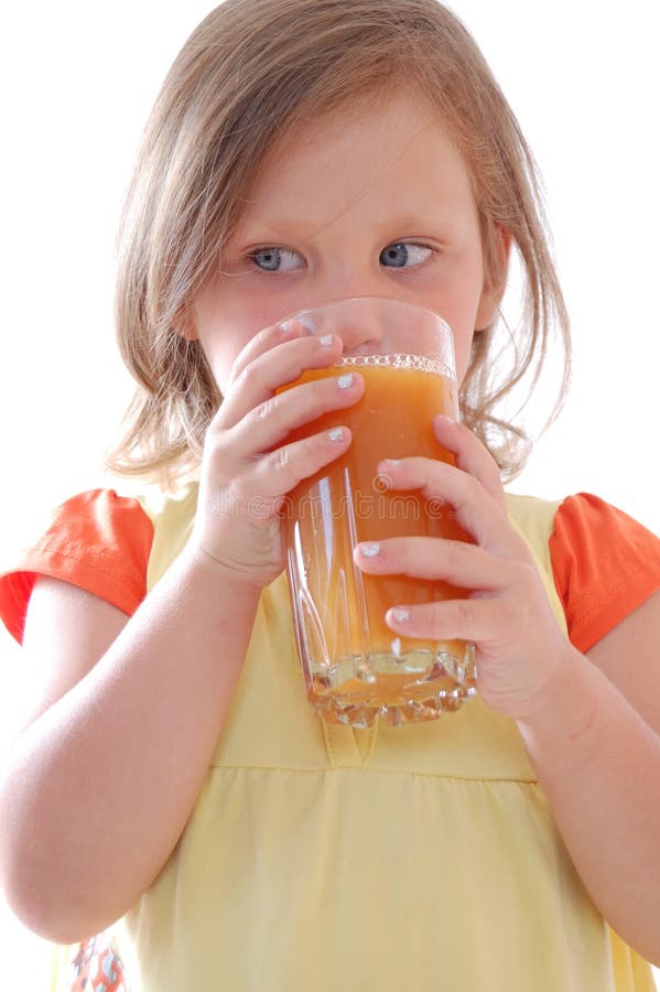 Little Girl Is Drinking Carrot Juice Stock Photo - Image of people