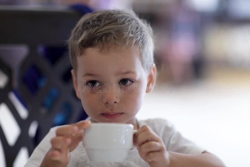 Child drinking tea stock image. Image of head, caucasian 46480587
