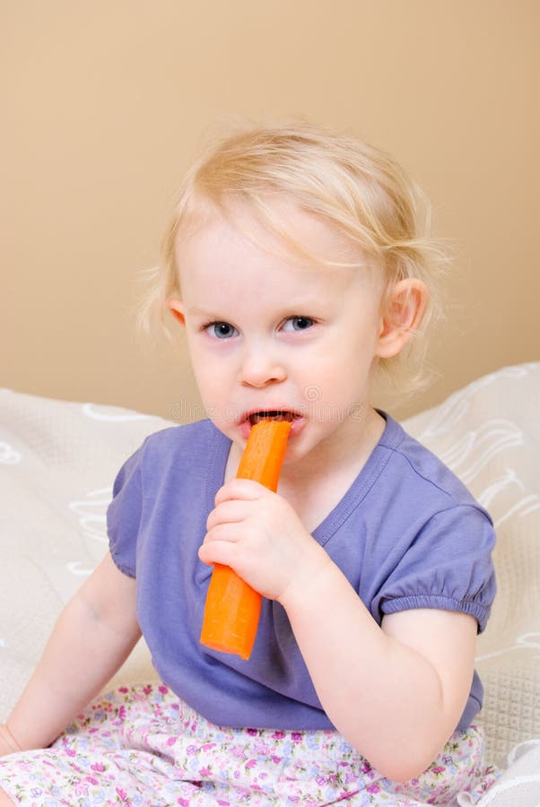 Child eating carrot stock photo. Image of orange, adorable 19110056