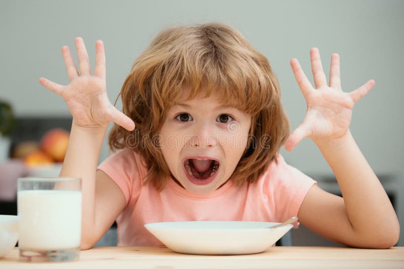 Child Eating Healthy Food At Home Baby Eat Soup With Spoon Stock child-eating-healthy-food-at-home-baby-eat-soup-with-spoon-stock