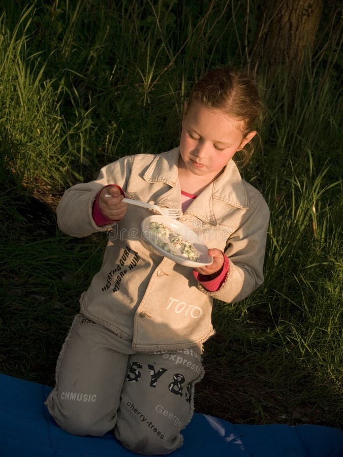 Child eating outside