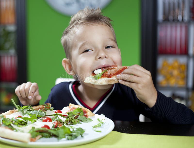 Child Eating Pizza in Restaurant Stock Photo - Image of joyful ...