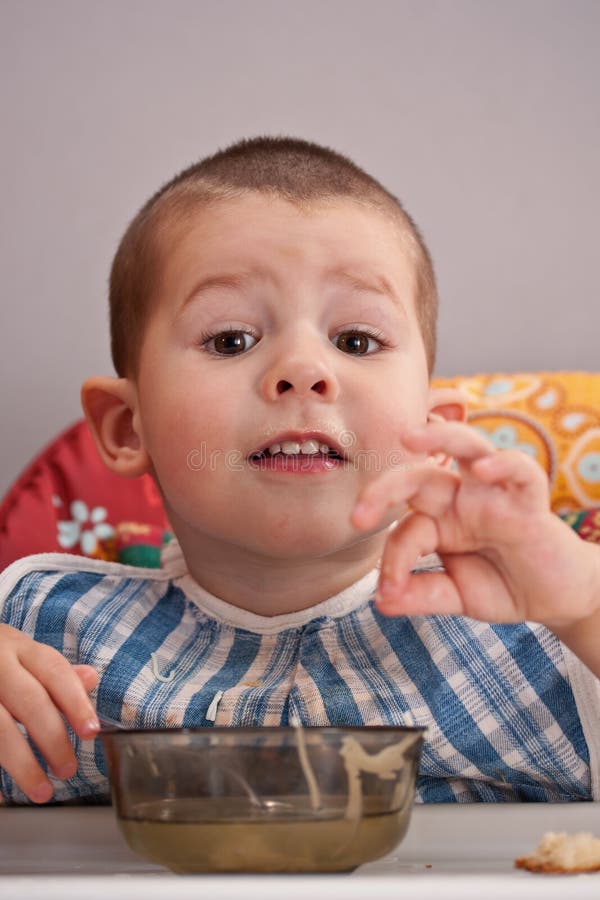 Child eating soup stock image. Image of preschool, child 20337727