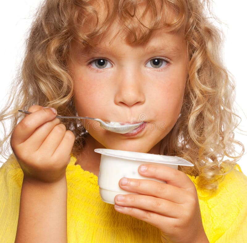 Child eating yogurt stock photo. Image of person, expressions 49245944