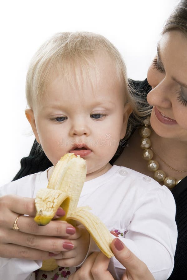 The child eats a banana.