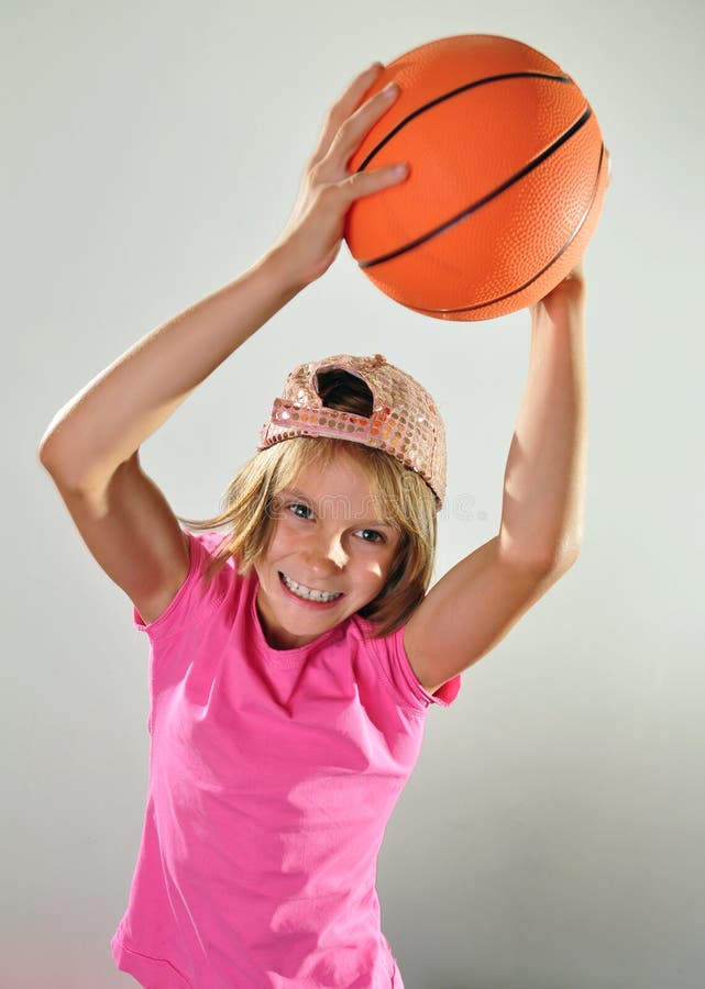 Child exercising with a ball