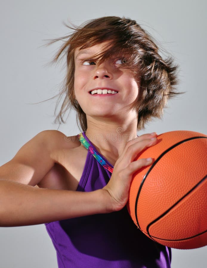 Child exercising with a ball