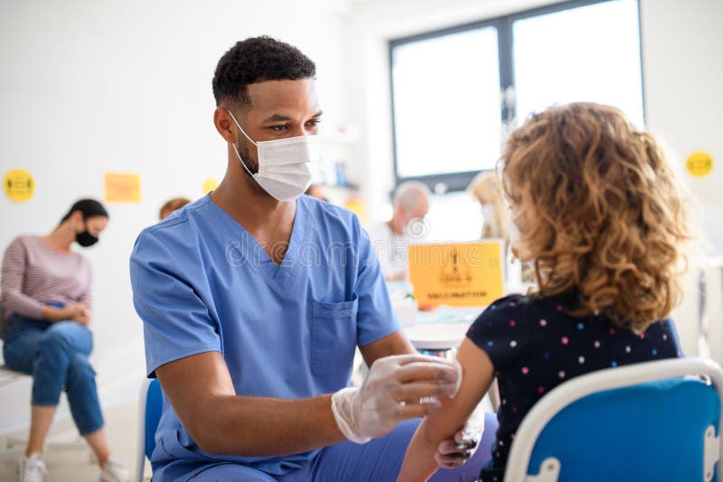 Child with face mask getting vaccinated, coronavirus, covid-19 and vaccination concept. royalty free stock photos Child with face mask getting vaccinated, coronavirus, covid-19 and vaccination concept. royalty free stock photos