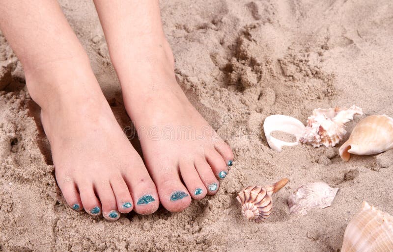 Child with feet in sand