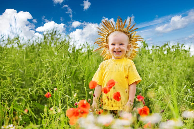 Child in the field of poppies