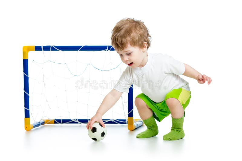 Child football player holding soccer ball