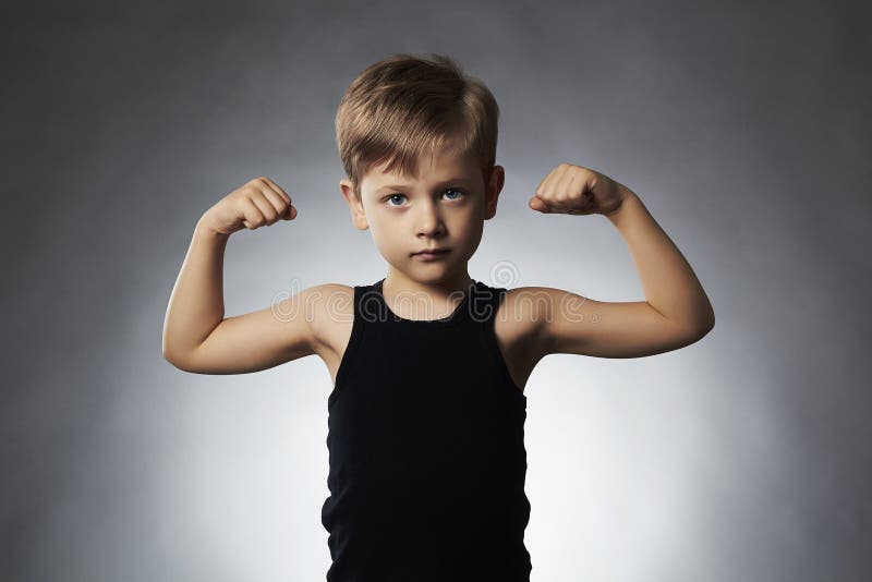 Child. Funny Little Boy.Sport Handsome Boy showing his hand biceps muscles royalty free stock photo Child. Funny Little Boy.Sport Handsome Boy showing his hand biceps muscles royalty free stock photo
