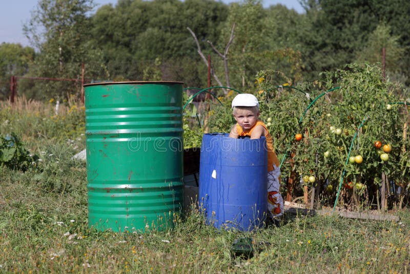 Child in the garden royalty free stock photos