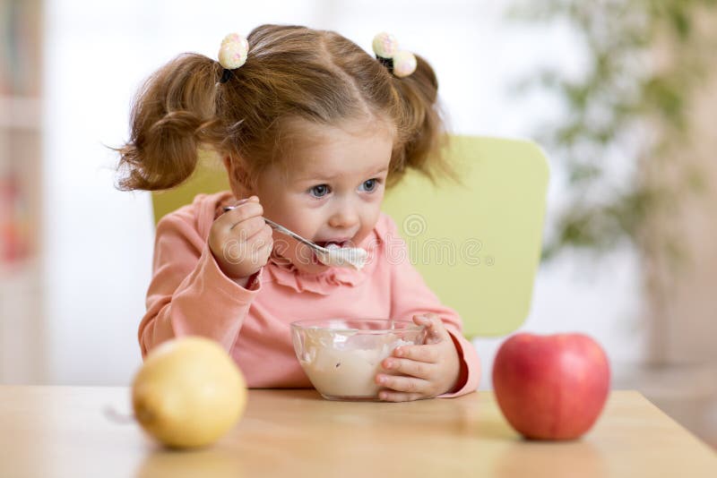 Child eating yogurt.