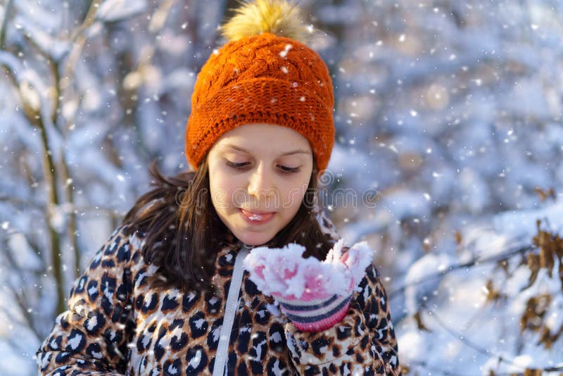 Child Girl Eats Snow and Having Fun in the Winter Forest, Bright ...