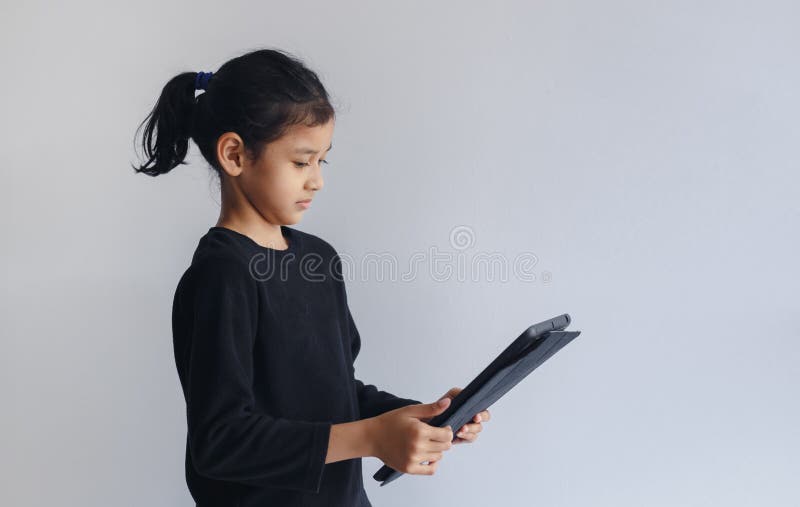 Child Girl Looking Digital Tablet Study Online. Little Girl Chatting