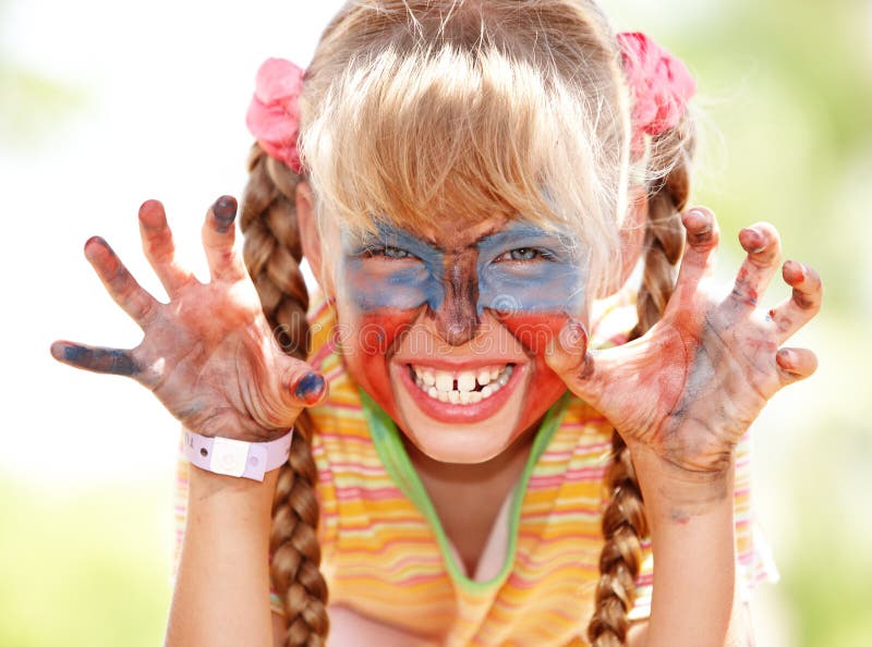 Child girl with paint on face. stock photo Child girl with paint on face. stock photo