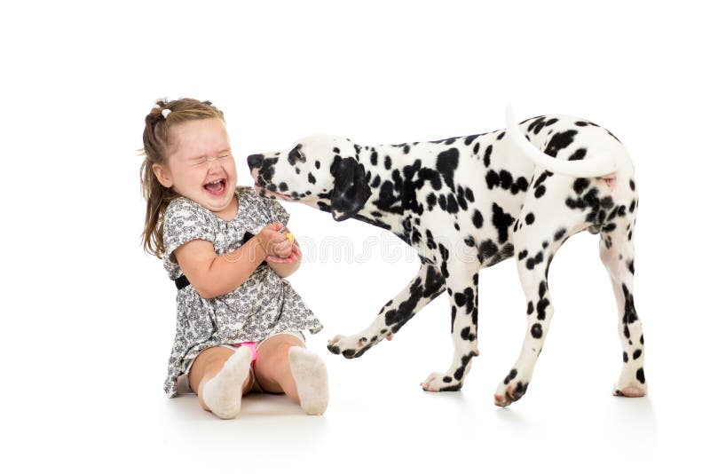 Child girl playing with dog
