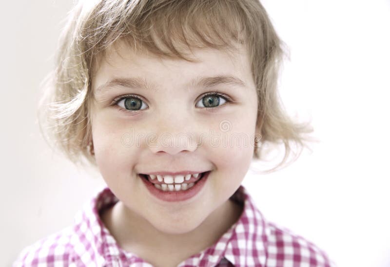 Child girl smiling face closeup.Toddler portrait. Nice happy kid stock image