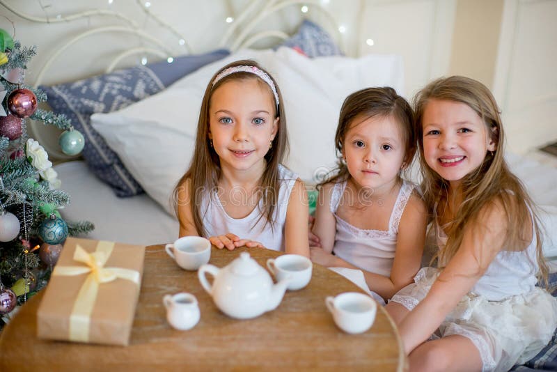 Child girls wake up in her bed in Christmas morning