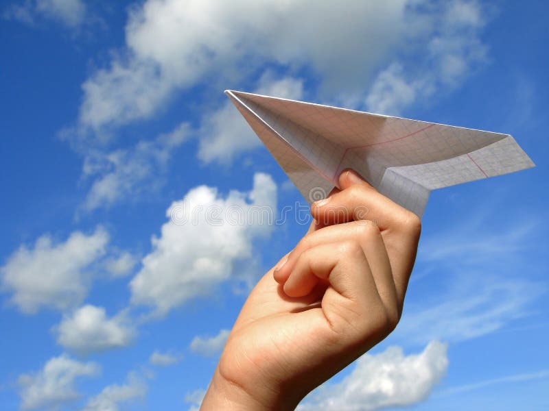 Child hand with paper plane