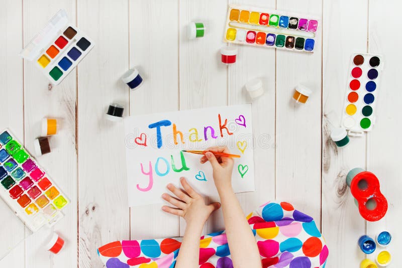 Child hand is writing in album word royalty free stock photo Child hand is writing in album word royalty free stock photo
