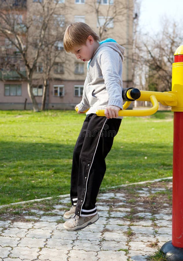 Child hanging on a bars stock photo. Image of innocence 19152648