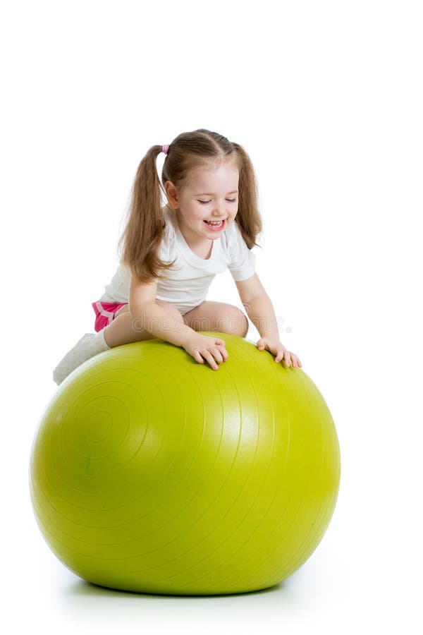 Child having fun with fit ball isolated