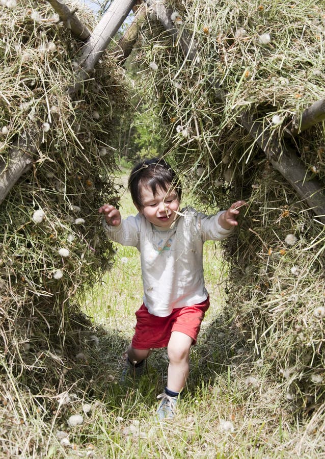 Child in hay stack