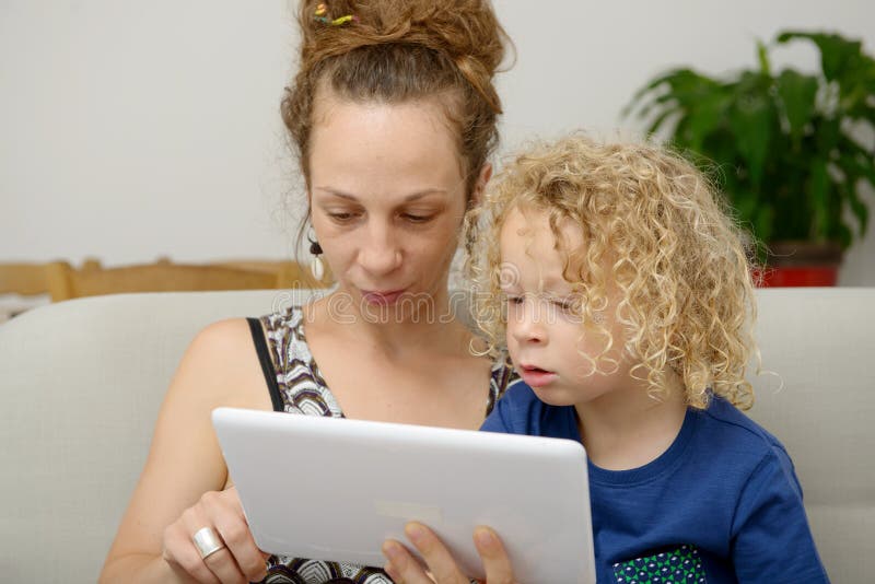 Child Her Mom Uses Tablet Stock Photos Free & RoyaltyFree Stock