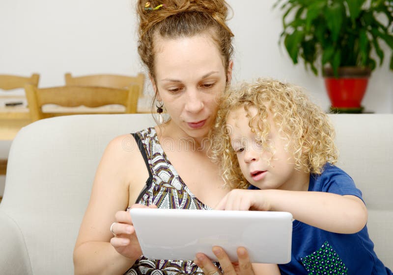 Child Her Mom Uses Tablet Stock Photos Free & RoyaltyFree Stock