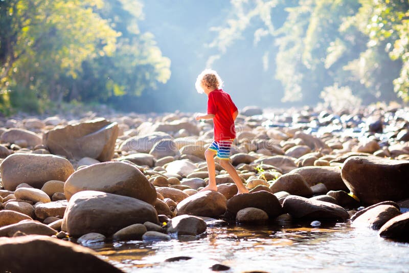 Child Hiking In Mountains Kids At River Shore Stock Photo Image Of