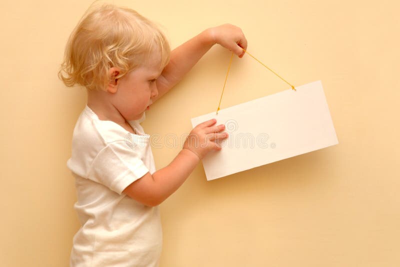 Child holding blank placard