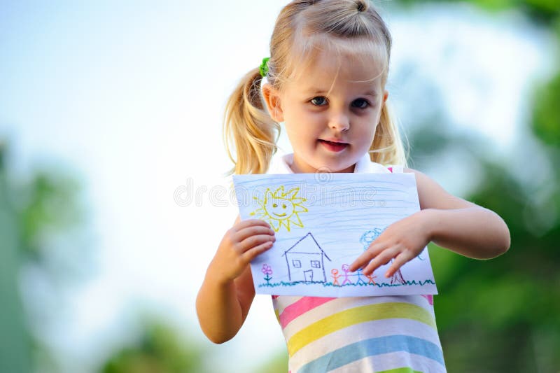 Child holding drawing