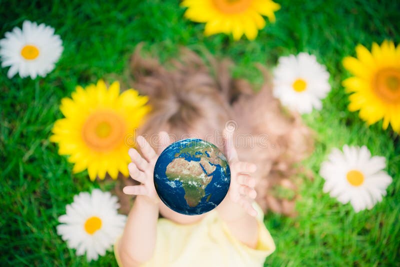 Child holding Earth planet in hands