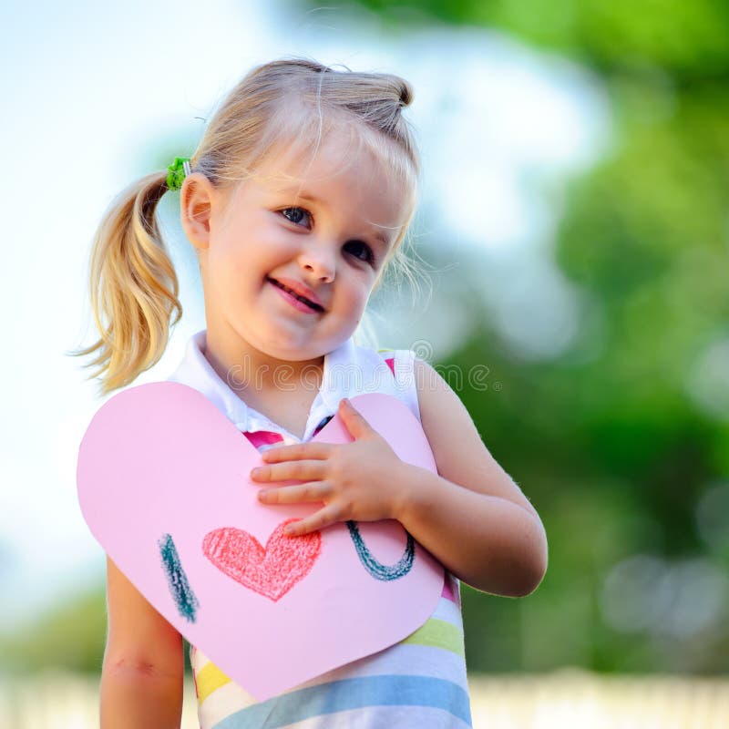 Child holding heart