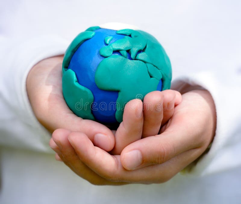 Child holding model of Earth royalty free stock photo Child holding model of Earth royalty free stock photo