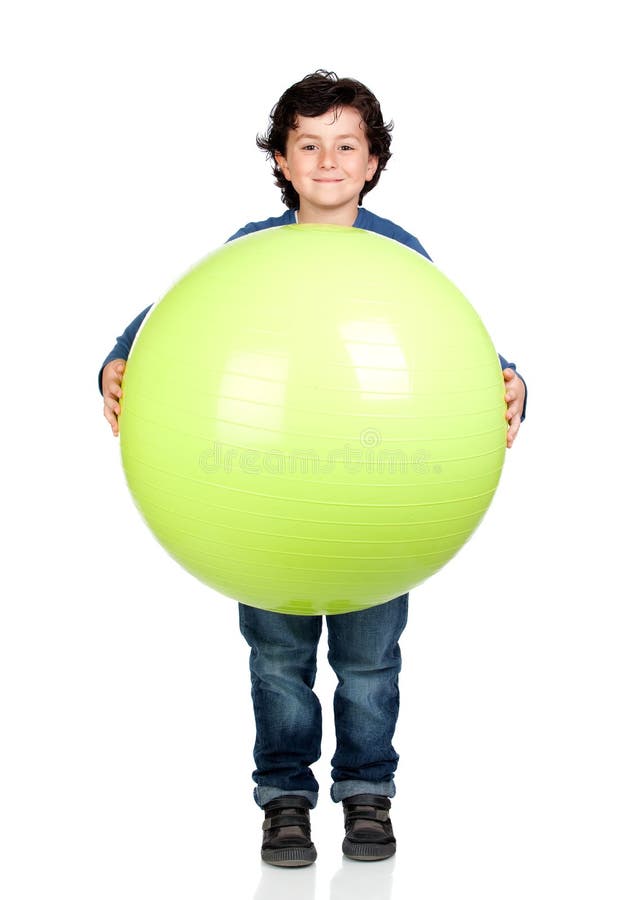 Child holding a pilates ball