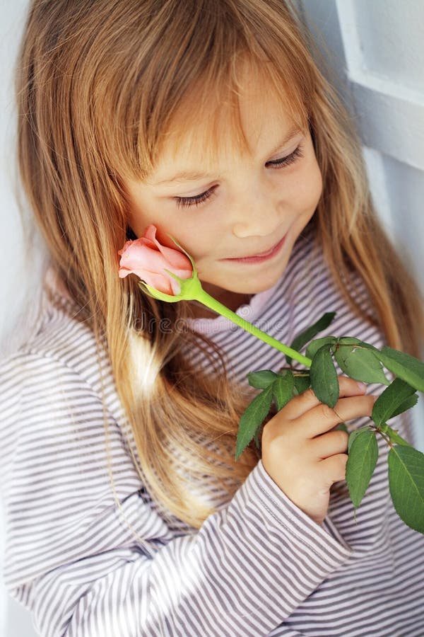Child holding rose stock image. Image of rose, childhood 16220943