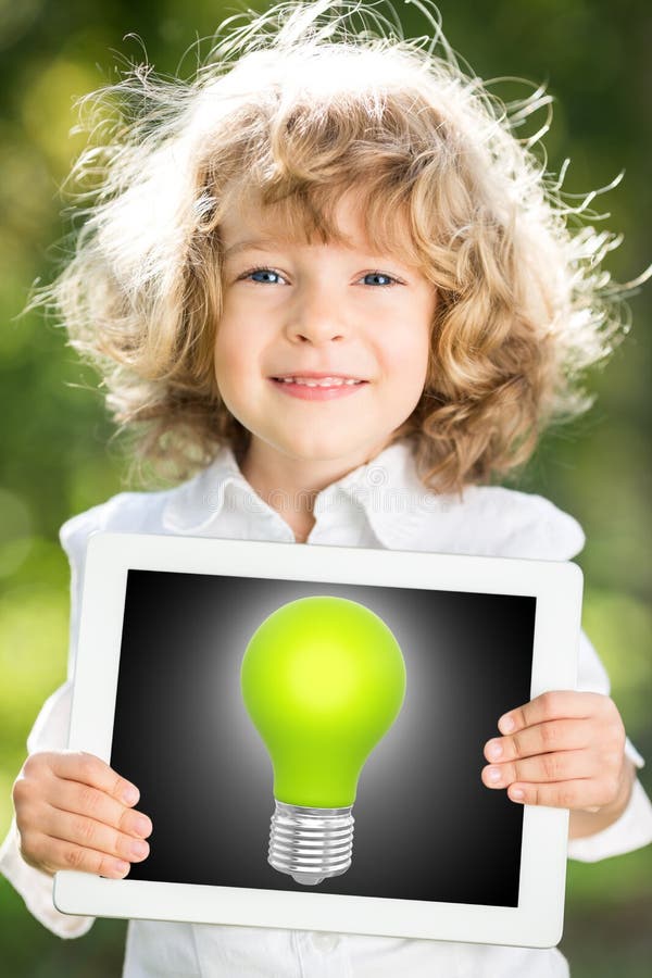 Child holding tablet PC with lightbulb