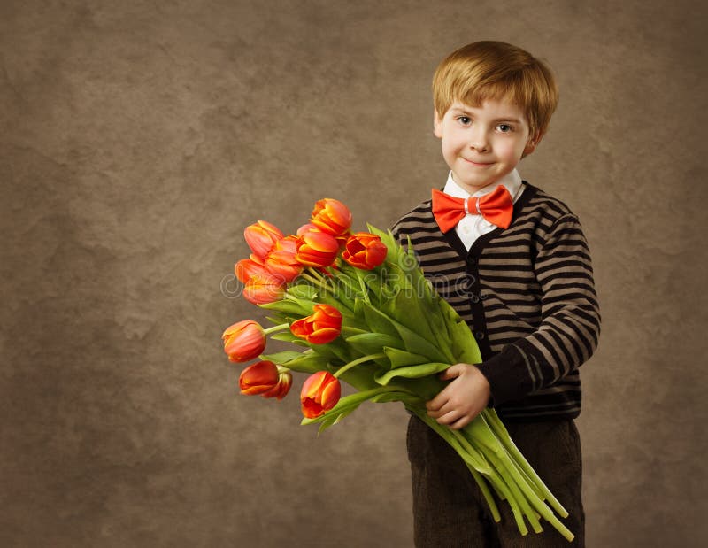 Child holding tulips flowers bouquet. Vintage style background