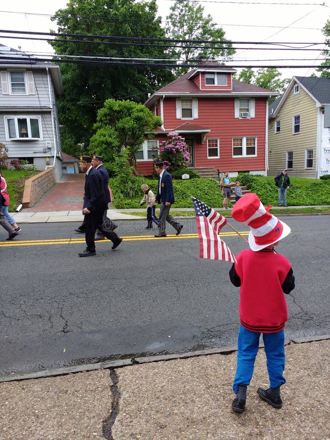 Child Holds an American Flag, Memorial Day Parade, USA stock image Child Holds an American Flag, Memorial Day Parade, USA stock image