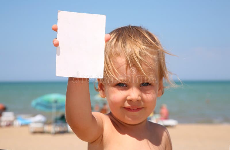 The child holds a paper